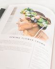 Photo of a page from the book of a woman wearing a flower crown