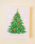 Christmas card with a decorated Christmas tree on a beige background